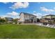 Spacious backyard with a patio, pergola, manicured lawn, and beautiful landscaping at 6692 S Robertsdale Way, Aurora, CO 80016