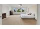 Spacious main bedroom with large windows offering natural light and neutral carpet at 6692 S Robertsdale Way, Aurora, CO 80016