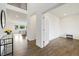 Inviting foyer with beautiful hardwood floors, high ceilings, and a view into the bright and airy living spaces at 6692 S Robertsdale Way, Aurora, CO 80016