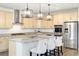 Modern kitchen featuring granite countertops, stainless steel appliances, and stylish pendant lighting at 6692 S Robertsdale Way, Aurora, CO 80016