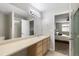 Bathroom features large mirror, ample counter space, and access to bedroom at 6450 W 44Th Pl # B3, Wheat Ridge, CO 80033