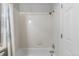 Clean bathroom with a shower-tub combination and tiled walls at 6450 W 44Th Pl # B3, Wheat Ridge, CO 80033