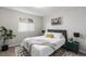 Cozy bedroom features sleek furniture, neutral colors, and a window at 6450 W 44Th Pl # B3, Wheat Ridge, CO 80033