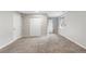 Bright, carpeted bedroom with closet, window, and neutral walls offers a versatile living space at 6450 W 44Th Pl # B3, Wheat Ridge, CO 80033