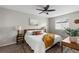 Bright bedroom features a ceiling fan, stylish decor, and neutral colors at 6450 W 44Th Pl # B3, Wheat Ridge, CO 80033