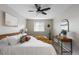 Bright bedroom features a large window, stylish decor, and neutral colors at 6450 W 44Th Pl # B3, Wheat Ridge, CO 80033