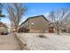 Exterior shot of a multi-Gathering dwelling with brick foundation and yard at 6450 W 44Th Pl # B3, Wheat Ridge, CO 80033