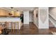 Open floor plan of a kitchen featuring a breakfast bar and access to the living and dining areas at 6450 W 44Th Pl # B3, Wheat Ridge, CO 80033