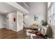 Sunlit living room featuring stylish decor, wood floors, and a comfortable seating arrangement at 6450 W 44Th Pl # B3, Wheat Ridge, CO 80033