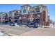 Well-maintained condominium complex with brick and siding, enhanced by private balconies and tidy landscaping at 3872 S Dallas St # 7-307, Aurora, CO 80014