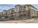 Modern condo building featuring brick accents, multiple stories, and private balconies at 3872 S Dallas St # 7-307, Aurora, CO 80014