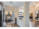 Open-concept kitchen offering stainless appliances, granite countertops, and seamless flow to dining and living areas at 3872 S Dallas St # 7-307, Aurora, CO 80014