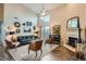 Bright living room boasts vaulted ceilings, a cozy fireplace, and access to a private balcony at 3872 S Dallas St # 7-307, Aurora, CO 80014