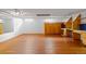 Spacious basement featuring a hardwood floor, a utility closet, and custom built-ins with lots of storage at 1960 Hudson St, Denver, CO 80220