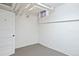Unfinished basement with concrete floor, white walls and plumbing, perfect for extra storage at 1960 Hudson St, Denver, CO 80220