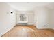 Spacious bedroom with hardwood floors, built-in shelves, and natural light at 1960 Hudson St, Denver, CO 80220