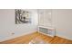 Bright bedroom featuring hardwood floors, neutral walls and paint, and two windows for natural sunlight at 1960 Hudson St, Denver, CO 80220