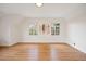 Bright bedroom with hardwood floors, natural light, and neutral decor at 1960 Hudson St, Denver, CO 80220