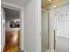 Hallway featuring white walls, a shower stall, and doorways that provide access to various areas at 1960 Hudson St, Denver, CO 80220