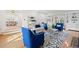 Bright living room features stylish seating, hardwood floors, and built-in shelving at 1960 Hudson St, Denver, CO 80220