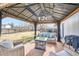 This backyard patio has an outdoor kitchen and living area with a gazebo at 15756 E Temple Pl, Aurora, CO 80015