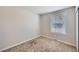Bright bedroom featuring neutral walls, plush carpeting, and a window offering natural light at 15756 E Temple Pl, Aurora, CO 80015