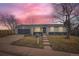 Charming single-story home featuring a well-manicured front yard and an attached garage, perfect for suburban living at 15756 E Temple Pl, Aurora, CO 80015