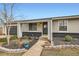 Inviting front entrance featuring a well-maintained landscape and a paved pathway leading to the front door, enhancing curb appeal at 15756 E Temple Pl, Aurora, CO 80015