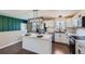 Updated kitchen featuring a center island with quartz countertops, modern lighting, and stainless steel appliances at 15756 E Temple Pl, Aurora, CO 80015