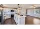 Well-lit kitchen boasting stainless steel appliances, modern countertops, and a spacious island perfect for food preparation at 15756 E Temple Pl, Aurora, CO 80015