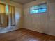 Bright bedroom with hardwood floors and two windows at 1890 Eaton St, Lakewood, CO 80214