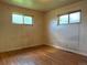 Bedroom with hardwood floors and natural light from windows at 1890 Eaton St, Lakewood, CO 80214