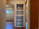 Hallway with a built-in shelving unit at 1890 Eaton St, Lakewood, CO 80214