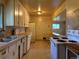 An airy kitchen with ample countertop space, white appliances, and tiled floors at 1890 Eaton St, Lakewood, CO 80214