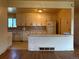 Traditional kitchen with tile backsplash and white cabinetry, awaiting a modern update at 1890 Eaton St, Lakewood, CO 80214