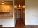 Bright kitchen area with white cabinets and bar-style seating at 1890 Eaton St, Lakewood, CO 80214