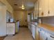 Kitchen with tile floors and matching appliances at 1890 Eaton St, Lakewood, CO 80214