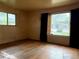 Sunlit living room featuring hardwood floors and large windows at 1890 Eaton St, Lakewood, CO 80214