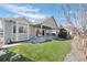 Lovely backyard featuring artificial turf, and a covered patio area perfect for outdoor entertaining at 20272 Terrace View Dr, Parker, CO 80134