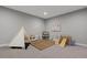 Fun basement area with play tent and climbing toys provides endless entertainment at 20272 Terrace View Dr, Parker, CO 80134