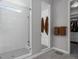Bright bathroom with a walk-in shower with glass doors and a view into the walk-in closet at 20272 Terrace View Dr, Parker, CO 80134