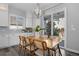 Dining area features natural light, modern light fixture, and an adjacent backyard patio entrance at 20272 Terrace View Dr, Parker, CO 80134