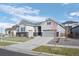 Charming single-Gathering home featuring neutral siding, a well-manicured lawn, and a spacious two-car garage at 20272 Terrace View Dr, Parker, CO 80134