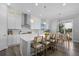 Bright and airy kitchen with white cabinets, an island with seating, and stainless steel appliances at 20272 Terrace View Dr, Parker, CO 80134