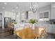 Open kitchen showcases stainless steel appliances, white cabinetry, and a center island with bar seating at 20272 Terrace View Dr, Parker, CO 80134