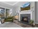 Bright living room features a fireplace, large windows, and access to the outdoor living spaces at 20272 Terrace View Dr, Parker, CO 80134