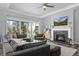 Inviting living room featuring a stone fireplace, large windows, and stylish decor at 20272 Terrace View Dr, Parker, CO 80134