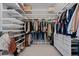 Organized walk-in closet features custom shelves, drawers, and ample storage space for clothing and accessories at 20272 Terrace View Dr, Parker, CO 80134