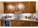 Basement wet bar with wine cooler and ample cabinetry at 370 S Glencoe St, Denver, CO 80246