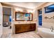 Elegant bathroom with double vanity, soaking tub, and shower at 370 S Glencoe St, Denver, CO 80246